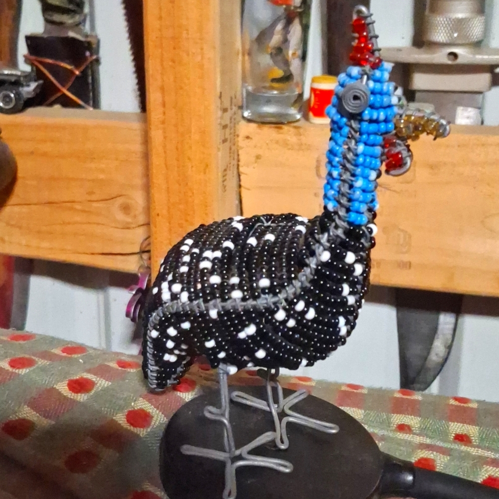 A vintage Africa Made Guinea bead Decorative Figuring